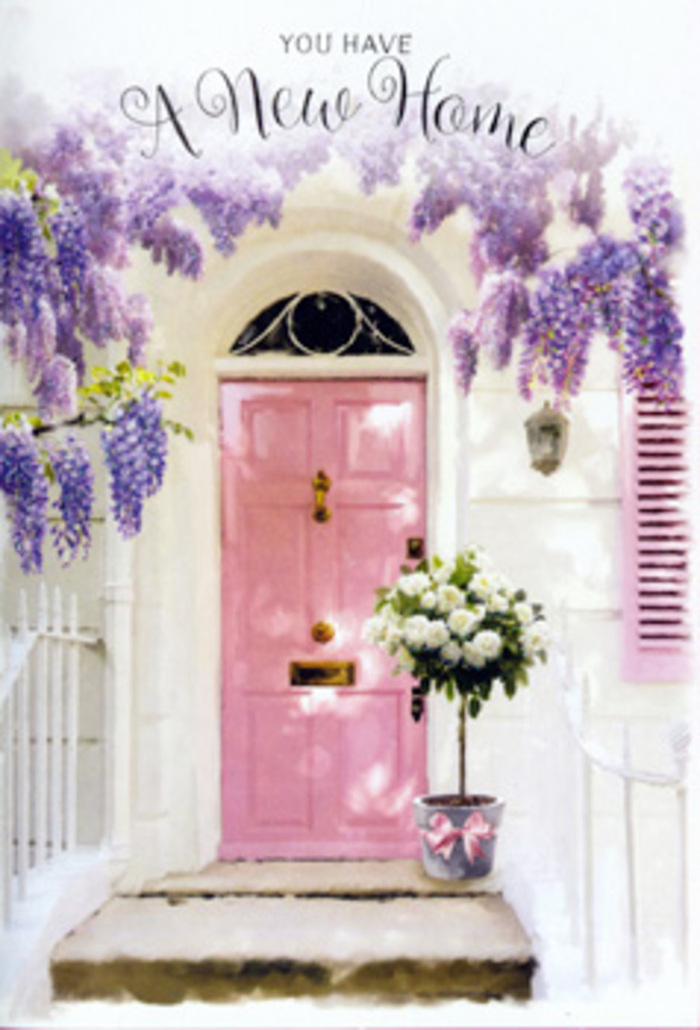 A tranquil front doorway in Egham is bathed in gentle light, showcasing a pastel pink door nestled beneath an arching canopy of lavender wisteria in full bloom. The wisteria trails down in loose, cascading garlands, each stem heavy with tiny clustered blossoms that create a soft, flowing curtain above the entrance. The whitewashed wall surrounding the door offers a clean, bright backdrop, while a simple shutter painted in harmonious tones picks up the play of light and shadow, suggesting the kind of peaceful atmosphere you might find wandering residential lanes off Egham High Street. At the doorstep, a grey metal bucket sits squarely on the stone, transformed into a housewarming arrangement that spills over with creamy white roses. These roses are generously open, their petals forming velvety rosettes that overlap in layers, with slender stems of fresh green foliage weaving between them for texture and contrast. Around the base of the bucket, a blush-pink ribbon is tied carefully, its smooth fabric catching the light just enough to echo the door's gentle hue and tie the whole composition together. You can almost sense the subtle blend of floral scents-the powdery sweetness of wisteria and the classic perfume of roses-carried on a soft breeze off nearby open spaces. The scene feels intimate and thoughtfully curated, as though someone from Flower Delivery Egham has placed this bouquet precisely here to greet new homeowners or to mark a special milestone. The overall mood is one of understated joy and expectation, a visual promise that this doorway will witness many happy arrivals, warm farewells, and everyday moments of contentment in the years ahead.